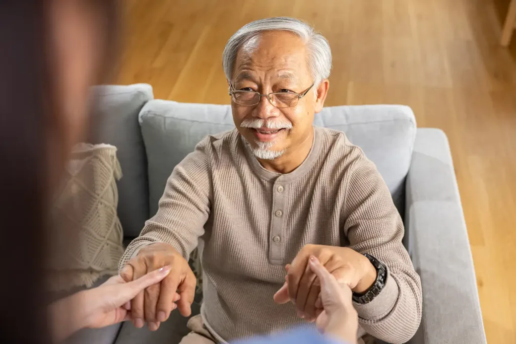 Senior receiving personal home care assistance and companionship at home
